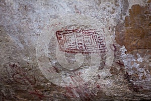 Prehistoric paintings on rock known as petroglyphs in Colombia