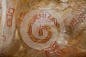 Prehistoric paintings on rock known as petroglyphs in Colombia