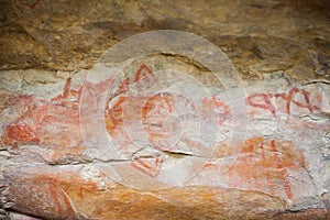 Prehistoric paintings on rock known as petroglyphs in Colombia