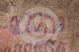 Prehistoric paintings on rock known as petroglyphs in Colombia