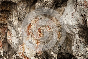 Prehistoric petroglyph rock paintings in Raja Ampat, West Papua, Indonesia photo