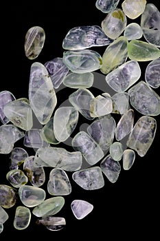 Prehnite heap up jewel stones texture on black background