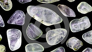 Prehnite rare jewel stones texture on black background. Moving right seamless loop backdrop