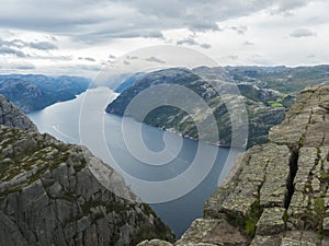 Preikestolen massive cliff at fjord Lysefjord, famous Norway viewpoint, no people.Moody autumn day. Nature and travel