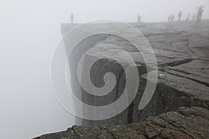 Preikestolen rock taken in deep fog, Norway fjord photo