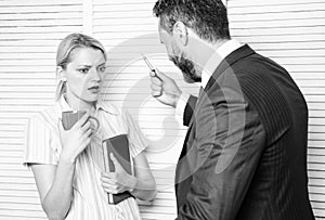 Prejudice and personal attitude to employee. Tense conversation or quarrel between colleagues. Boss discriminate female photo