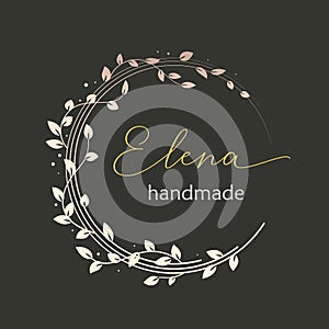 Premade logo design with golden floral wreath. Tree branches and leaves. Feminine logotype template