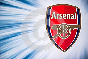 LONDON, ENGLAND, JULY. 1. 2019: Arsenal Football club logo, Premier League, England. Soccer player silhouette