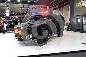 Premium armored vehicle displayed in a car show, safety and luxury automobile | INKAS