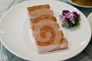 Premium Chinese crispy roasted belly pork in White dishes at Chi