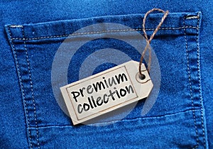 Premium collection tag on blue jean background.