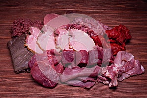 Premium cuts of raw steak. Fresh and raw meat. Raw meat mixture. Raw beef steaks on wooden table