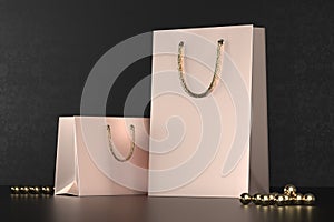 Premium shopping bags mock-up, package for purchases on a black background. Rose gold paper shopping bag with golden