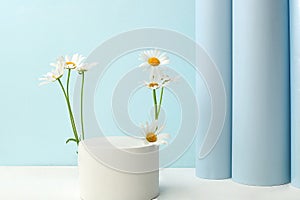 Premium stage for showcasing product and business concept. Minimal modern aesthetic. Beautiful flower arrangement with white