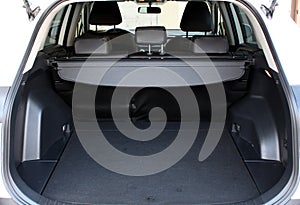 Premium SUV open trunk. Open empty trunk in the modern SUV. Car boot space shot. Modern SUV open trunk. Ready for luggage loading.