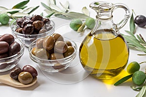 Premium virgin olive oli and variety of olives.