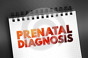 Prenatal Diagnosis - detecting problems with the pregnancy as early as possible, text on notepad, concept background