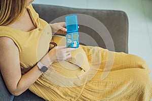 Prenatal Vitamins. Portrait Of Beautiful Smiling Pregnant Woman Holding Pill Box, Taking Supplements For Healthy