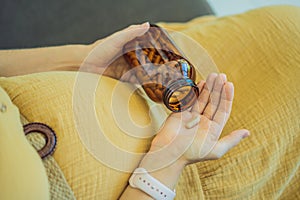 Prenatal Vitamins. Portrait Of Beautiful Smiling Pregnant Woman Holding Transparent Glass Jar With Pills, Taking