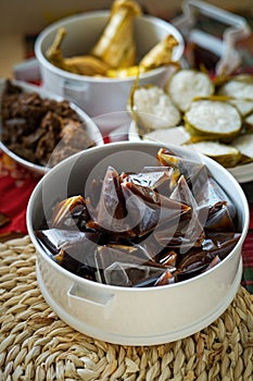 Prepacked bite size Dodol in a container during Raya celebration in Malaysia