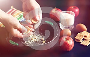 Preparation of apple pie at home. Homemade pastries with apples and nuts. Sweet dessert from apples baked