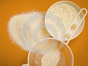 Preparation for baking, ingredients flour sifting.