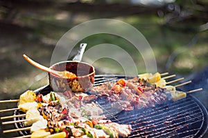 Preparation of barbecue, Grilled skewers on plate outdoor
