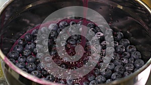 preparation of blueberry jelly with gelatin pour in a thin stream into an iron plate refrigerate to make jelly healthy