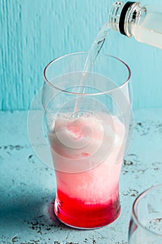 Preparation of cocktail Terremoto. Chilean traditional alcoholic drink Terrremoto. with pineapple ice cream, liquor photo