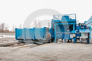 Preparation of a container with waste for subsequent transportation to a waste disposal plant. Waste processing plant