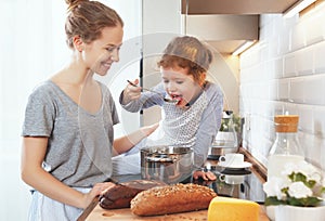 Preparation of family breakfast. mother and child daughter cook