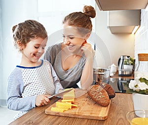 Preparation of family breakfast. mother and child daughter cook