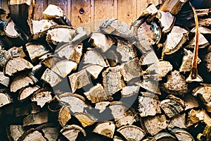 Preparation of firewood for the winter. firewood background, Stacks of firewood in the forest. Pile of firewood.