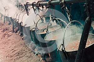 Preparation of food in open-fire boilers