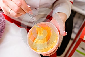 Preparation of a golden mask, a procedure at a beautician, facial care