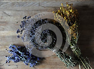 Preparation of herbal teas and dried flowers on a wooden board