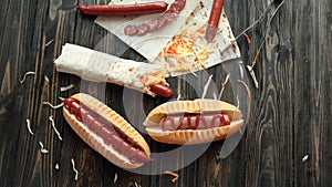 preparation of hot dogs with sausage.photo on a wooden backgroun