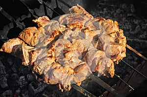 Preparation of juicy kebab in nature by the body autumned with natural woodwood.
