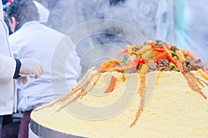 Preparation of a large couscous outdoors. Moroccan festival