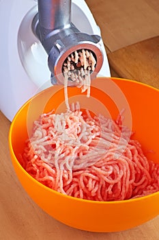 Preparation of minced meat using a meat grinder.