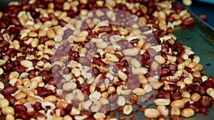 Preparation of peeled and roasted peanuts for further use in cooking