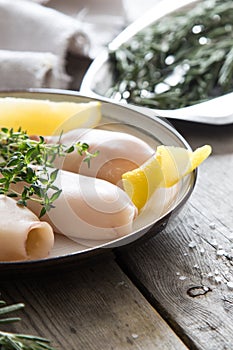 Preparation of raw squid and ingredients on the table