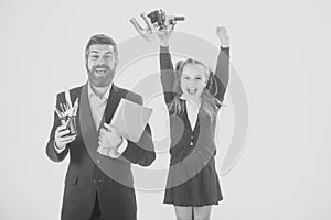 Preparation for school. Father and schoolgirl with happy faces isolated on white