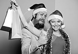 Preparation success. happy family couple xmas. santa man and woman with tinsel. christmas shopping sales. winter