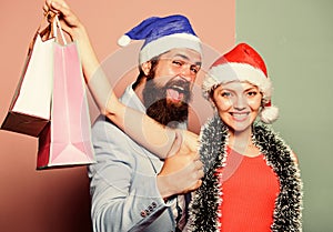 preparation success. happy family couple xmas. santa man and woman with tinsel. christmas shopping sales. winter
