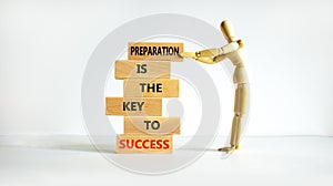 Preparation and success symbol. Wooden blocks with words Preparation is the key to success on on a beautiful white background,