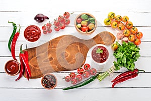 Preparation of tomato sauces and seasonings. Cherry tomatoes, spices, chili peppers.