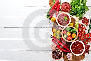 Preparation of tomato sauces and seasonings. Cherry tomatoes, spices, chili peppers.