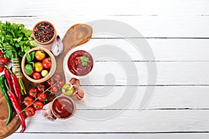 Preparation of tomato sauces and seasonings. Cherry tomatoes, spices, chili peppers.