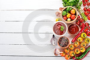 Preparation of tomato sauces and seasonings. Cherry tomatoes, spices, chili peppers.